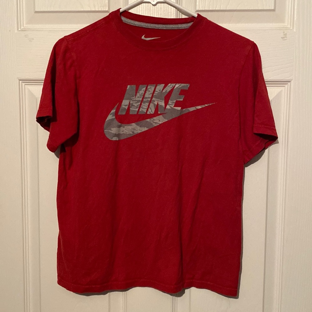 Boys Nike T-shirt size large there’s a couple spots on the shirt